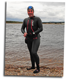 Mike prepares to swim across the River Spey